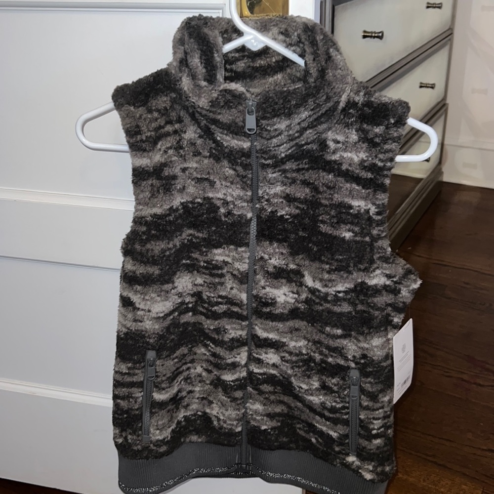 Very comfortable vest, brand new, and very flattering